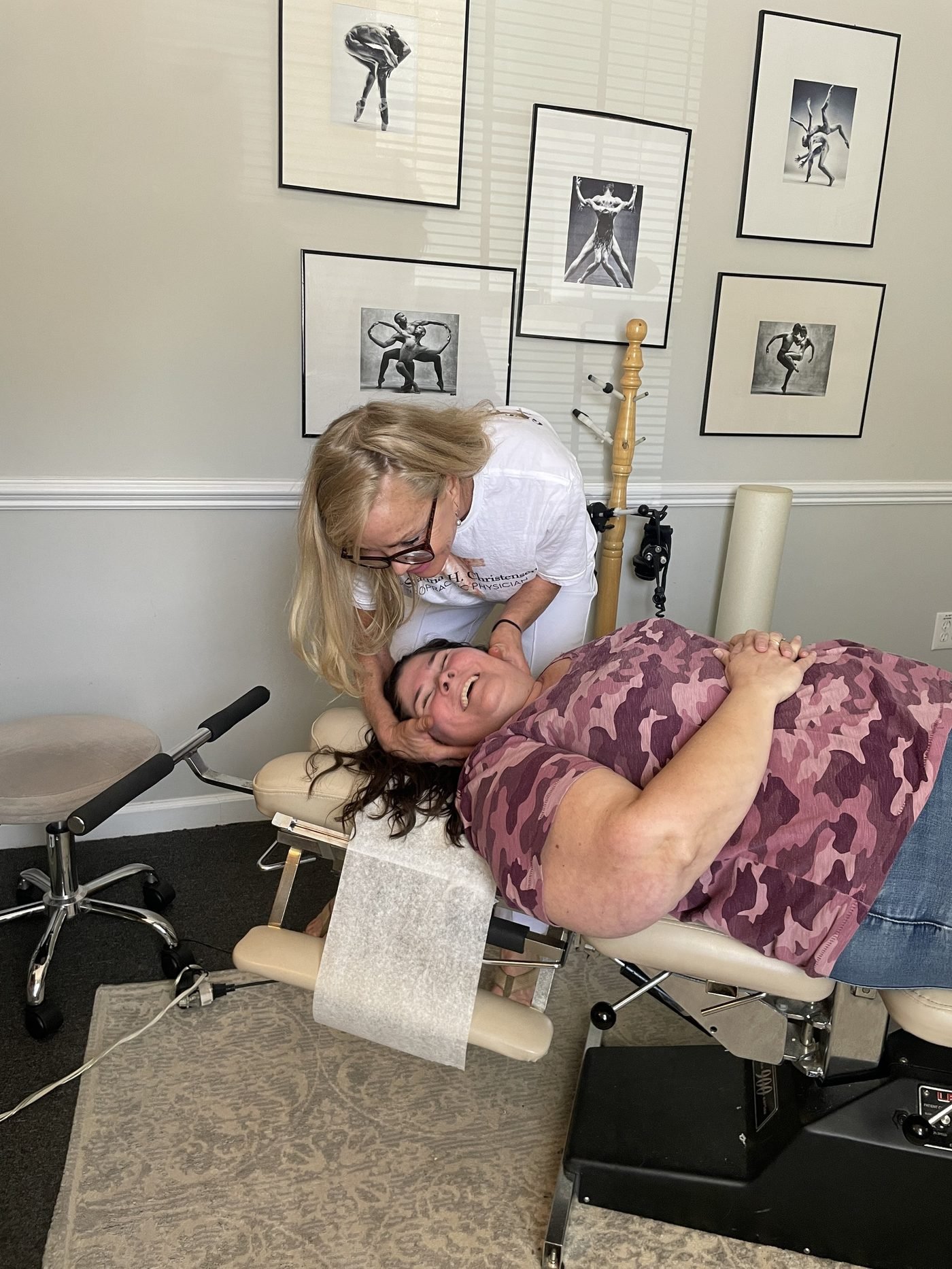 Dr. Christensen laughing with a patient during treatment