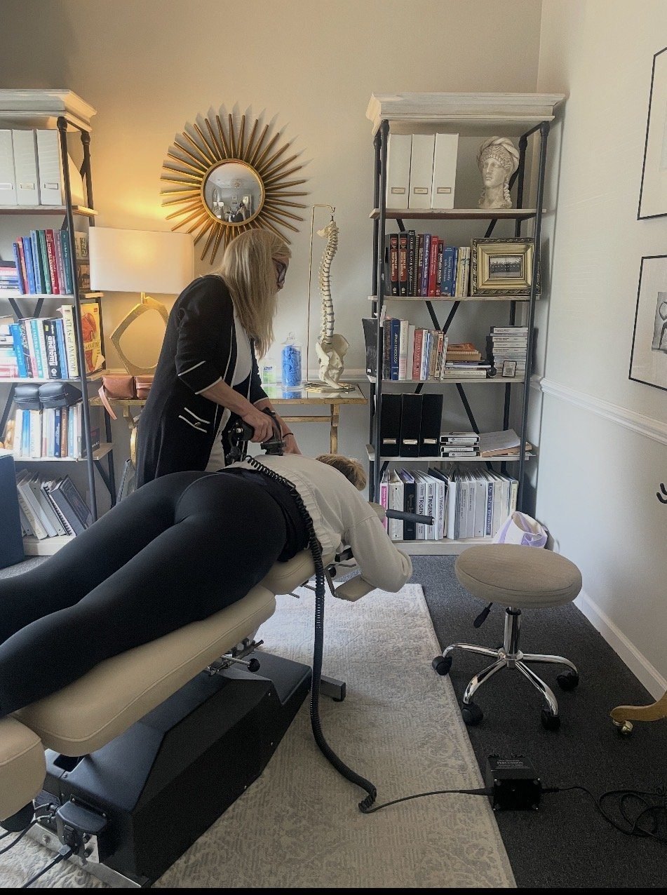 Percussion therapy before an adjustment