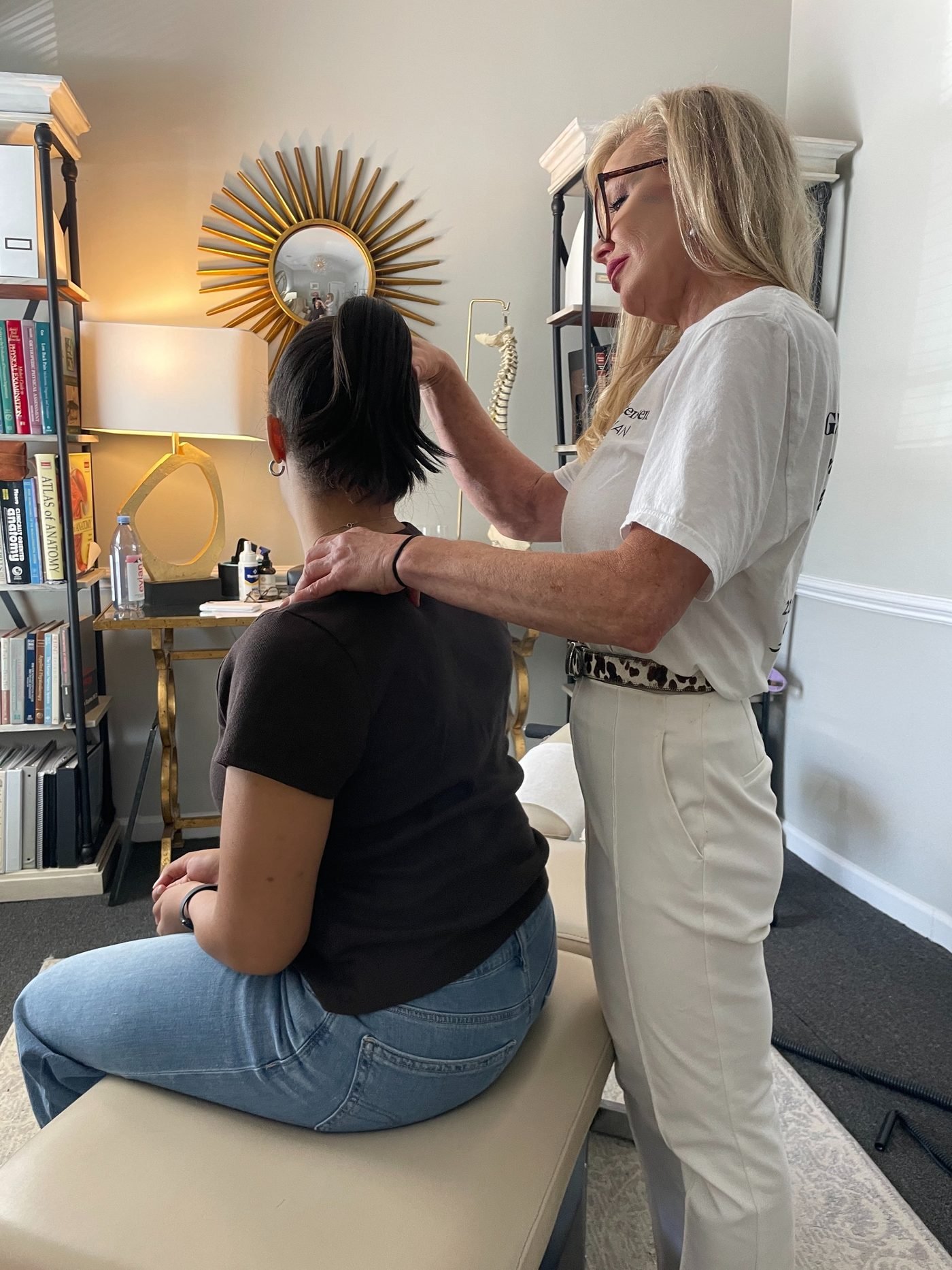 Dr. Christensen working with a seated patient